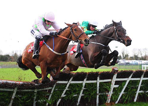 Landofhopeandglory (Barry Geraghty, right) clears the last with Bapaume and Ruby Walsh