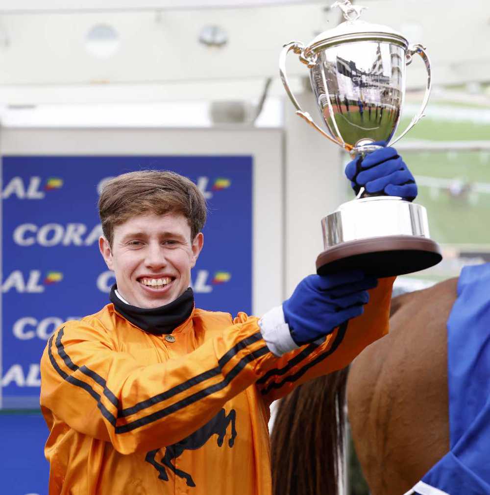 Richie Condon proudly holds the Coral Cup at Cheltenham