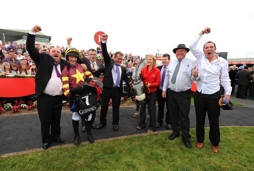 Chicago Grey with jockey Paul Carberry, trainer Gordon Elliott (third from right), owner John Earls (left) and friends