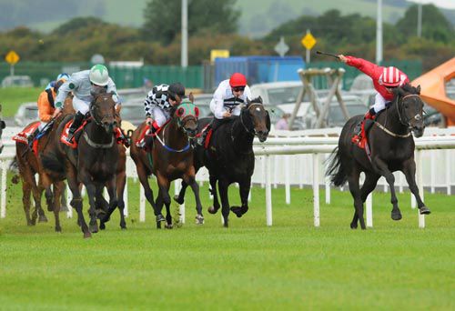 Good to Follow (red) beats Blue Dahlia (green star on cap) at the Curragh