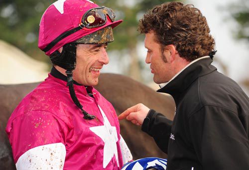 Davy Russell and Paul Nolan happy men after the success of Warhead