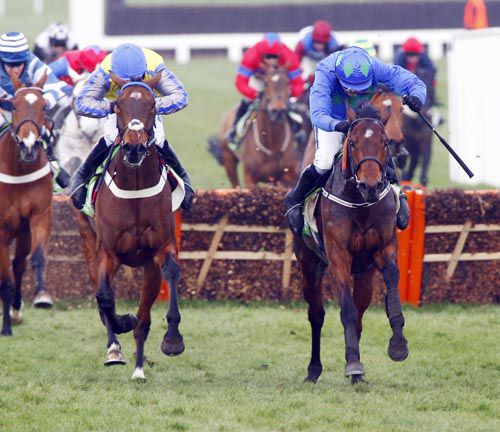 Hurricane Fly (right) beating Peddlers Cross in the Stan James Champion Hurdle at Cheltenham