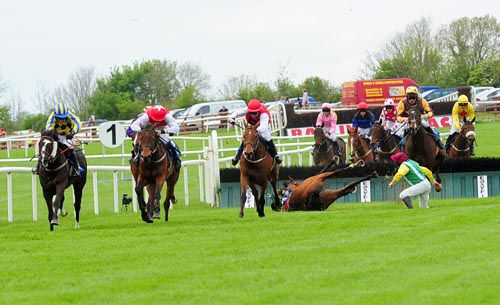 Face Facts (white sleeves, red cap with white star) is about to win as Fair Dilemma (Shay Barry) crash out