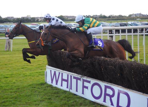 Good Decision (nearside) jumps the final fence alongside Gracchus