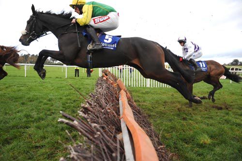 Blackwell Synergy throws a fine leap on his way to winning the 3m handicap hurdle