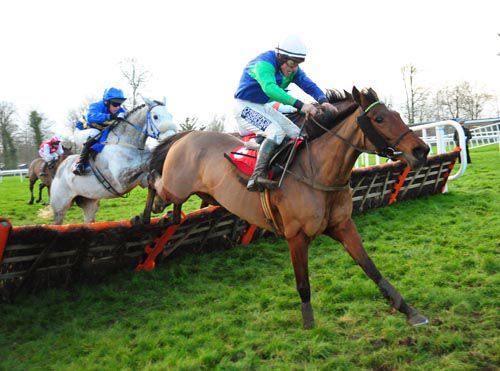 Knockbrack Vic leads over the last in the hands of Philip Enright