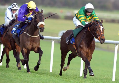 Mark Walsh pushes Sportsmaster (right) out to victory in the opener at Naas from Hisaabaat in second 