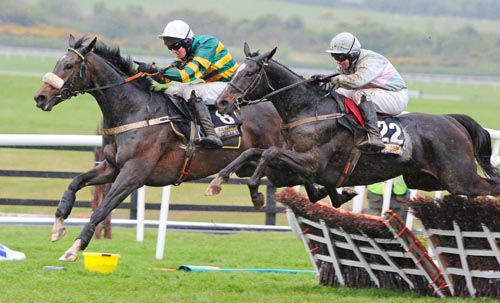 Sort It Out, left, keeps up the gallop in Punchestown