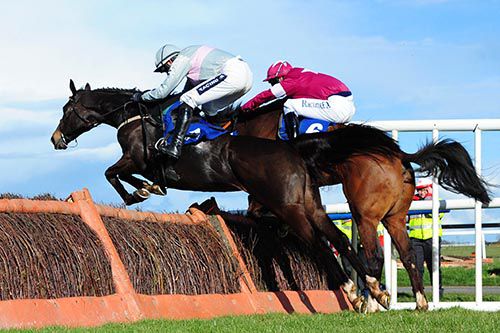 Clondaw Warrior and Ruby Walsh (nearside) come to take over from The Plan Man and David Mullins