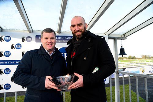 Connacht Rugby Captain John Muldoon presents Gordon Elliott with his prize after the win of Automated