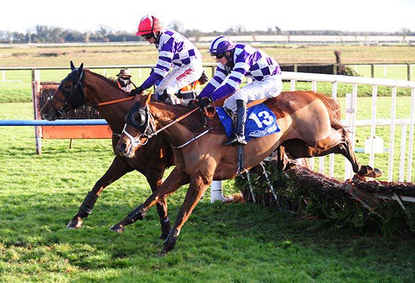 Mystic Embarr (Danny Mullins, nearside) battles it out with Flemenstorm (Chris Timmons)