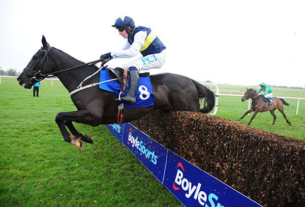 Franco De Port and Paul Townend  jump the last ahead of Whatsnottoknow
