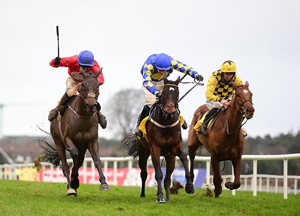 A Plus Tard, left, comes to cut down Kemboy, centre, with Melon back in third