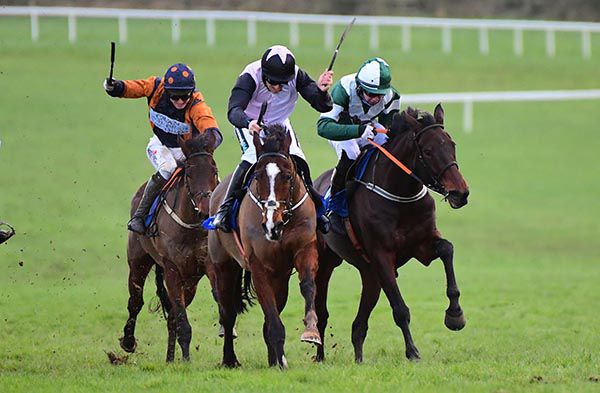 Blazing Khal (right) is impeded but still wins under Philip Byrnes