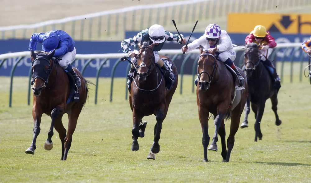 Poetic Flare (check cap) winning 2000 Guineas at Newmarket