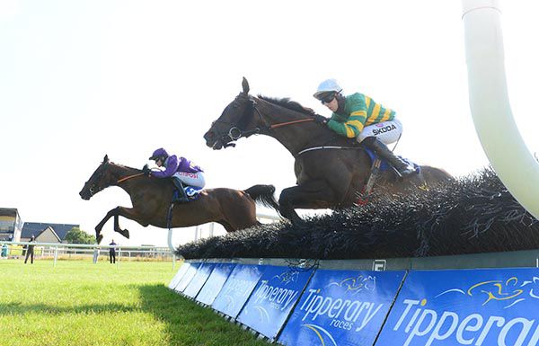 Smitty Bacall and Danny Mullins (far side) jump one of the earlier hurdles en route to victory
