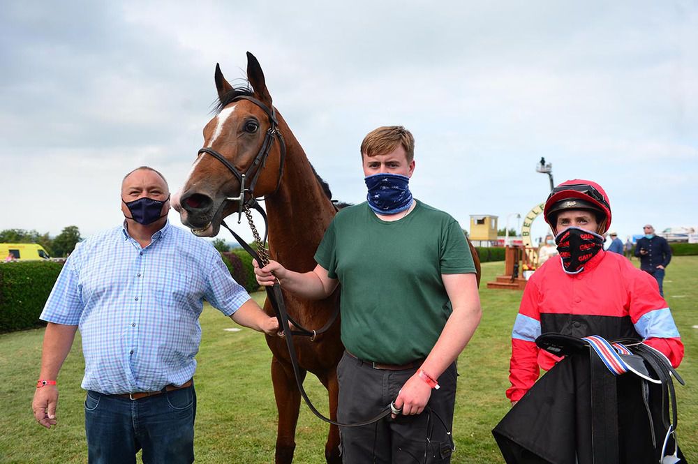 Red Heel and Leigh Roche with trainer Michael Mulvany, left, and his son and groom Larry Mulvany 