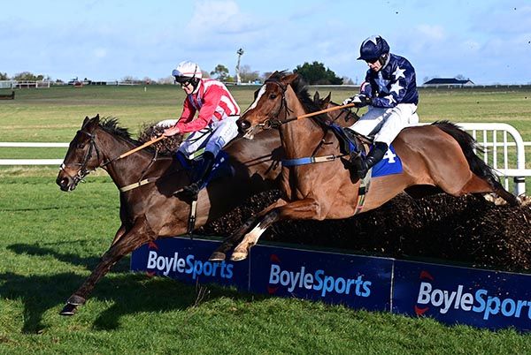 Hollybank King (left) jumps past Brandy Harbour at the last 

