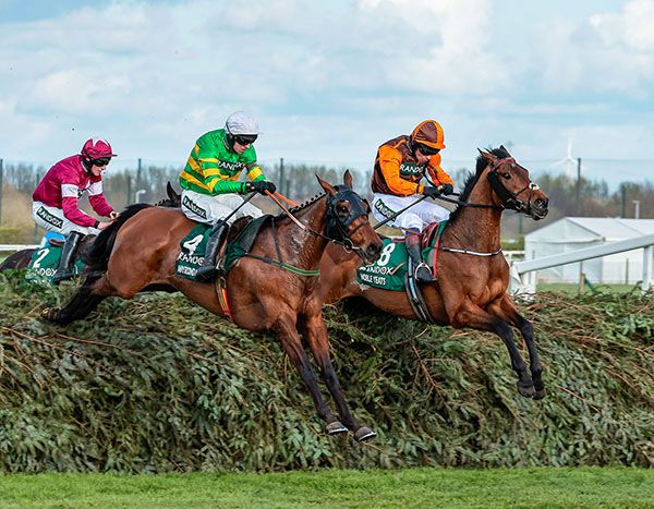 Noble Yeats (right) and Any Second Now jumping the last at Aintree last year