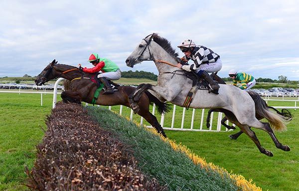 Everglow and Denis O'Regan (far side) jump the last to win from Chinx Of Light
