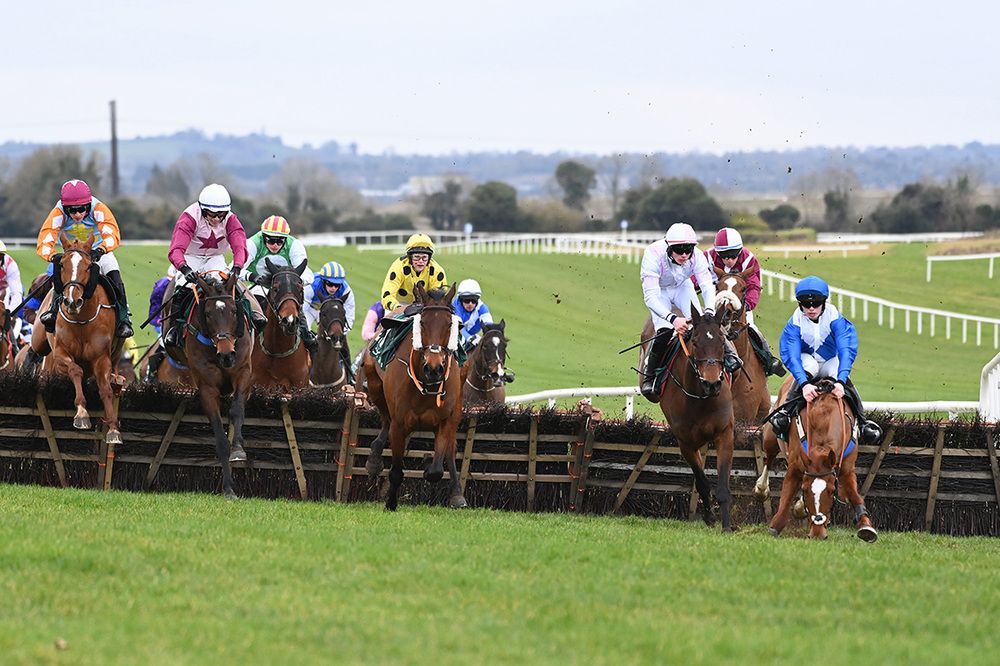 Wa Wa (second left) takes advantage as Indie Belle blunders at the last
