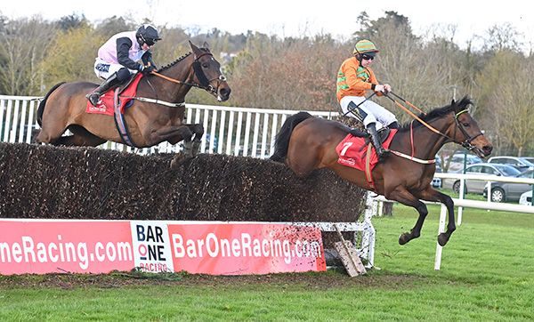 Dinny Lacey (left) takes full advantage as Ultimate Optimist blunders at the last 