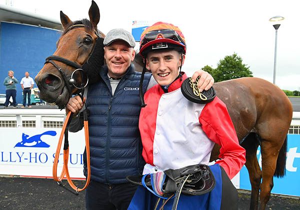 Calum Hogan pictured with his dad Ray after riding his first winner aboard Bear Claws at Limerick last summer
