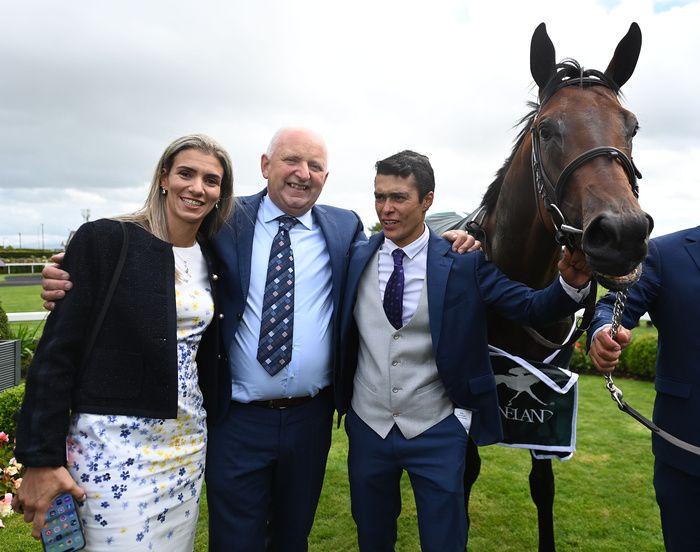 Bucanero Fuerte with trainer Adrian Murray alongside joint owner Giselle De Aguiar and husband Robson.