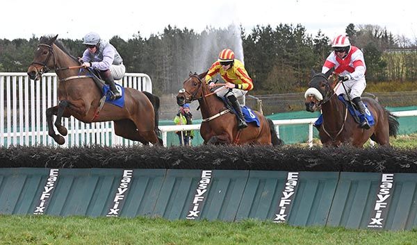 Mag Dillane (left) puts in a fine leap at the last under Mark McDonagh
