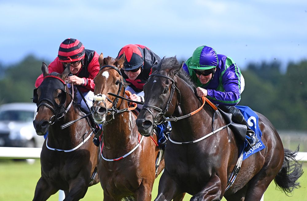 Tango Flare and Seamie Heffernan (right) win from Dandyville (centre) and Warrior Brave (left)