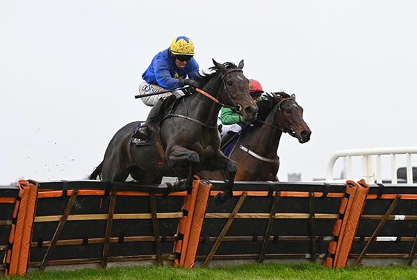 Ms Agartha Yeats jumps the last in front of Laravie