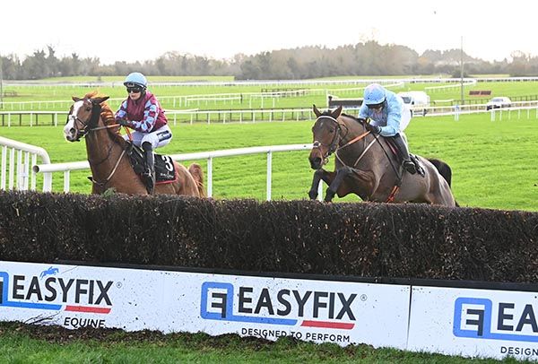 Sam Magee (right) and St Denis's Well jumping the last